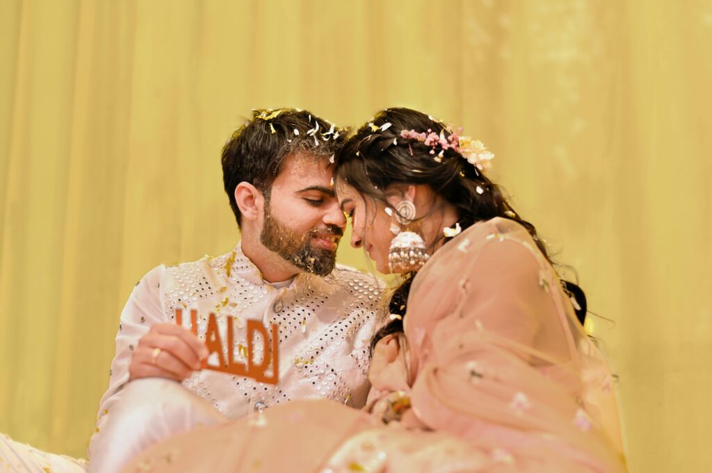 Couple enjoys an intimate moment during traditional Haldi ceremony.